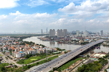 Top view aerial of center Ho Chi Minh City and Saigon bridge with development buildings, transportation