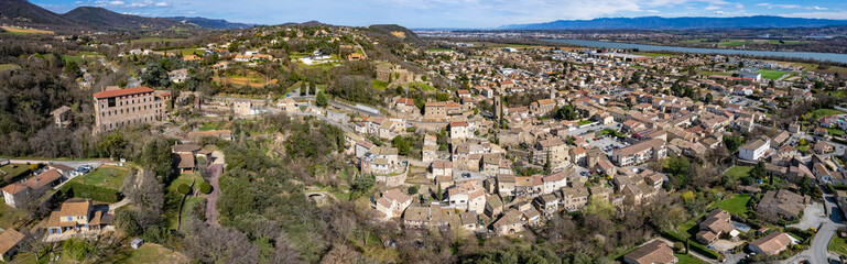 Aerial around the city Charmes-sur-Rhone in France on a sunny day in early spring.