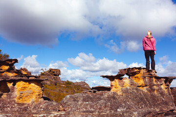 Woman on a pagoda rock Blue Mountains Australia - 587948043