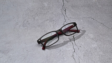 Glasses, stylish accessory, in plastic frame on gray background, close-up, banner, place for text