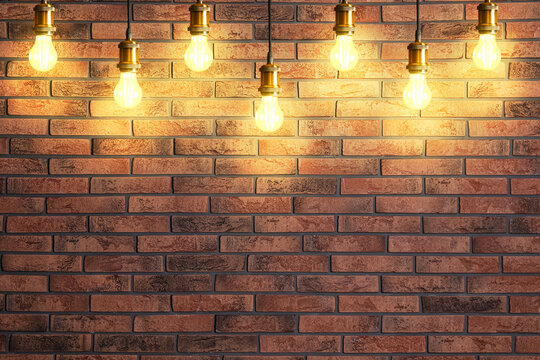 Many pendant lamps against red brick wall