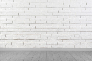 Room with brick wall and wooden floor