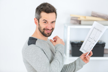 Fototapeta premium real-estate agent checking house plans