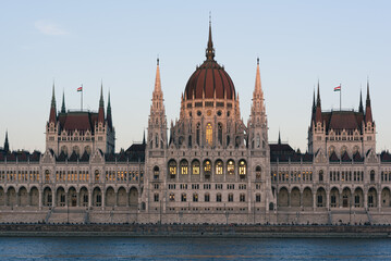 Fototapeta na wymiar The last rays of sun illuminate the Hungarian Parliament building in Budapest
