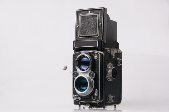 Twin-lens reflex camera isolated on white background