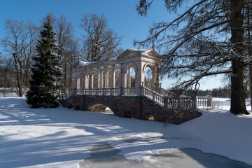 Marble bridge on the shore of a Large pond in the Catherine Park in Tsarskoye Selo on a sunny...