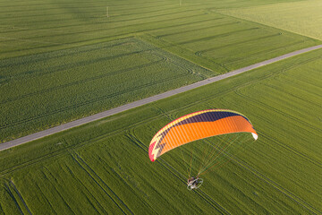 aerial view paraglider over the fields