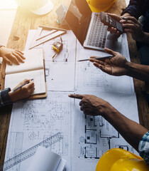 Construction and structure concept of engineer working drawing on blueprint meeting for project...
