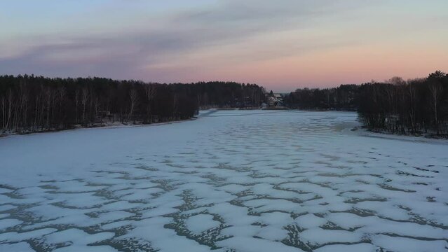 Aerial landscape of the frozen lake in Poland at sunset
