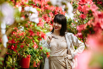 A girl in a flower park on a sunny day