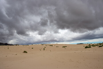 Sand dunes and cloudy sky, Fuerteventura, Spain