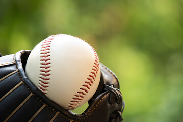 Baseball equipment on nature background.