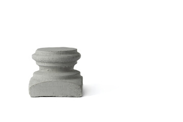 Concrete pedestal of gray color for subject shooting. Concrete figure on a white background. Isolate. Space for text