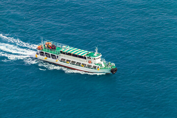 Passenger ferry with green decks sails the Japan Sea