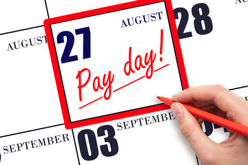 Hand writing text PAY DATE on calendar date August 27 and underline it. Payment due date