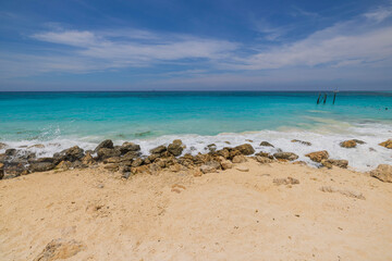 Fototapeta na wymiar Beautiful view of coastline of beach Atlantic ocean with stones. Aruba.