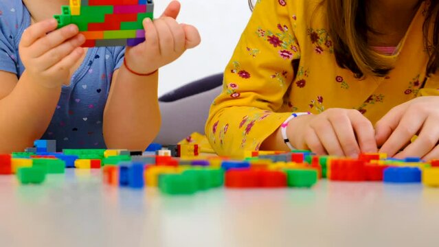 Constructor child plays in the room. Selective focus.