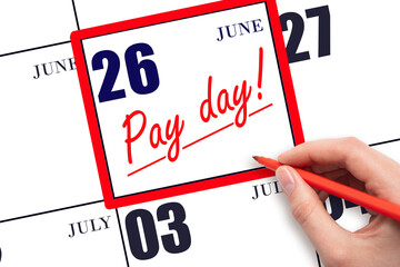 Hand writing text PAY DATE on calendar date June 26 and underline it. Payment due date