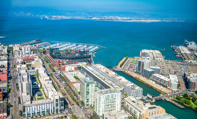 Fototapeta na wymiar San Francisco, California - August 7, 2017: Aerial view of San Francisco stadium and port from helicopter on a clear sunny day.