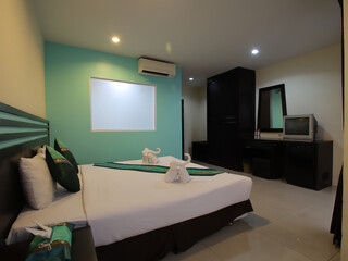 Hotel Room Decorated single bedroom with bed nice colours