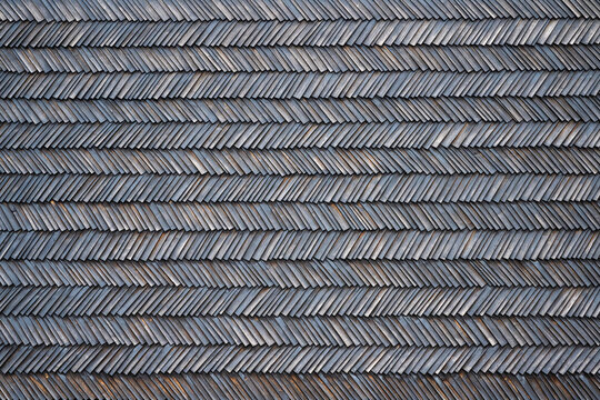 Herringbone pattern of wooden shingle facade