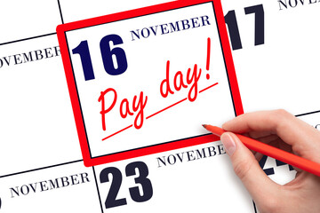 Hand writing text PAY DATE on calendar date November 16 and underline it. Payment due date