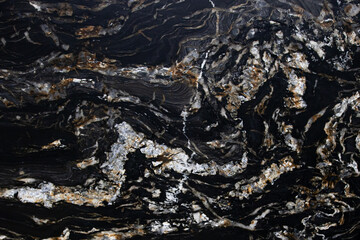 Black spanish matt granite slab with gold blured waved lagoon Belvedere Extra close up