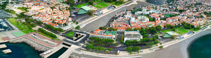 Funchal, Madeira. Aerial view of city center from a drone flying over the port