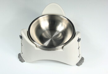 Empty metal bowl on white background, cat food