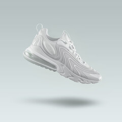 White sneaker  sport shoe on a gray gradient background, sport concept, men's fashion, sport shoe, air, sneakers, lifestyle, concept, product photo, levitation concept, street wear, trainers