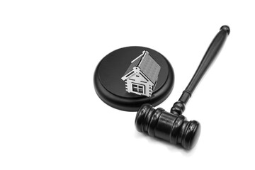 Abstract photo with wooden gavel and abstract house isolated on white background