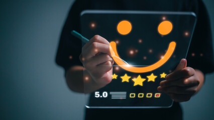 The customer creates a happy face smiling symbol using a digital pen on a futuristic virtual...