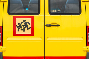 Rear view of yellow school bus