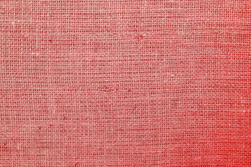 Red burlap with beautiful canvas texture of red fabric in retro style