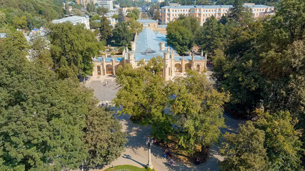 Fototapeta na wymiar Kislovodsk, Russia. Narzan Gallery - an architectural monument of the XIX century, located in the resort park of the city of Kislovodsk, Aerial View