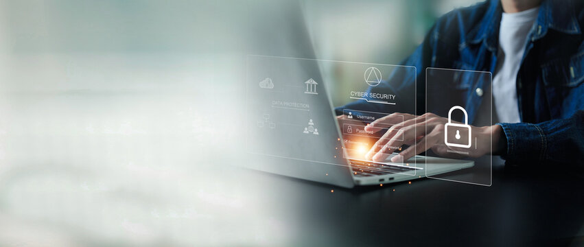 businesman is using laptop for cyber security protection , security login with key , user privacy security , encryption and data ,Cybersecurity and privacy concepts.