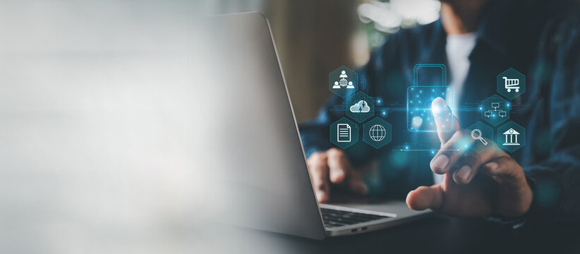 businesman is using laptop for cyber security protection , security login with key , user privacy security , encryption and data ,Cybersecurity and privacy concepts.