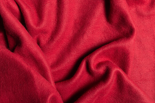 Top view red fleece fabric with creases