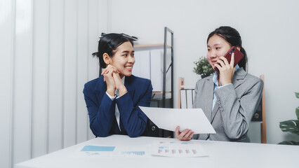 Fototapeta premium Young Asia female leader business woman coaching new smes bookkeeping audit accounting interview with trainer training business job.