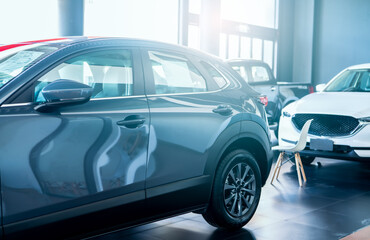 Car parked in luxury showroom. Car dealership office. New car parked in modern showroom for sale...