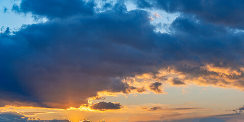Naklejka na ściany i meble Beautiful evening sky with clouds at sunset.