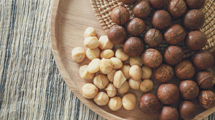 Organic Macadamia nut. macadamia nuts are cracked and baked to taste extremely delicious superfood fresh natural shelled unsalted raw macadamia and healthy food concept