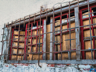 An old window with an iron grille
