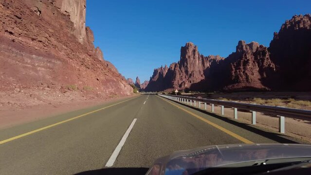 Al Disah, Saudi Arabia: Point of view of a car driving on the road toward the Wadi Al Disah canyon in the Tabuk region in Saudi Arabia.