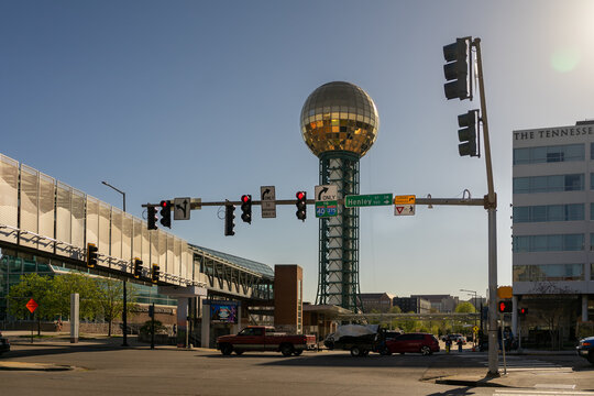 Traffic intersection near Sunsphere and world's fair park.  Henley street Knoxville.  Tennessean Hotel in the background.