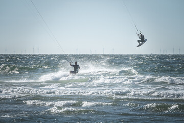 Kite surfers water sport event at neach in Zeeland