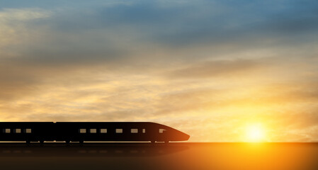 High speed train silhouette in motion at sunset. Fast moving modern passenger train on railway...