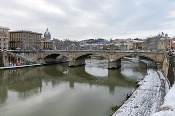 Rome under the snow. Vatican City in Italy on a snowy day. St. Peter's basilica in the background,...