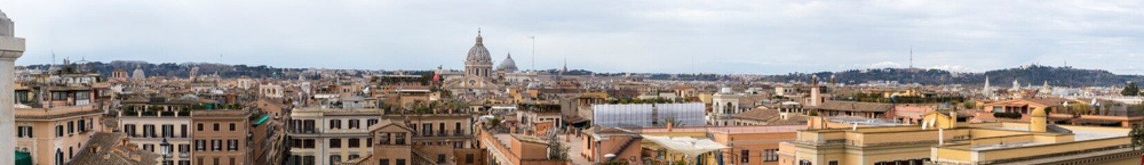 Fototapeta na wymiar Rome as the capital of Italy seen from above. Panorama view of Roman city with St. Peter's Basilica, colosseum and Roman forums.