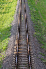 Fototapeta na wymiar Railway track for the train. Rails view from above, going into the distance